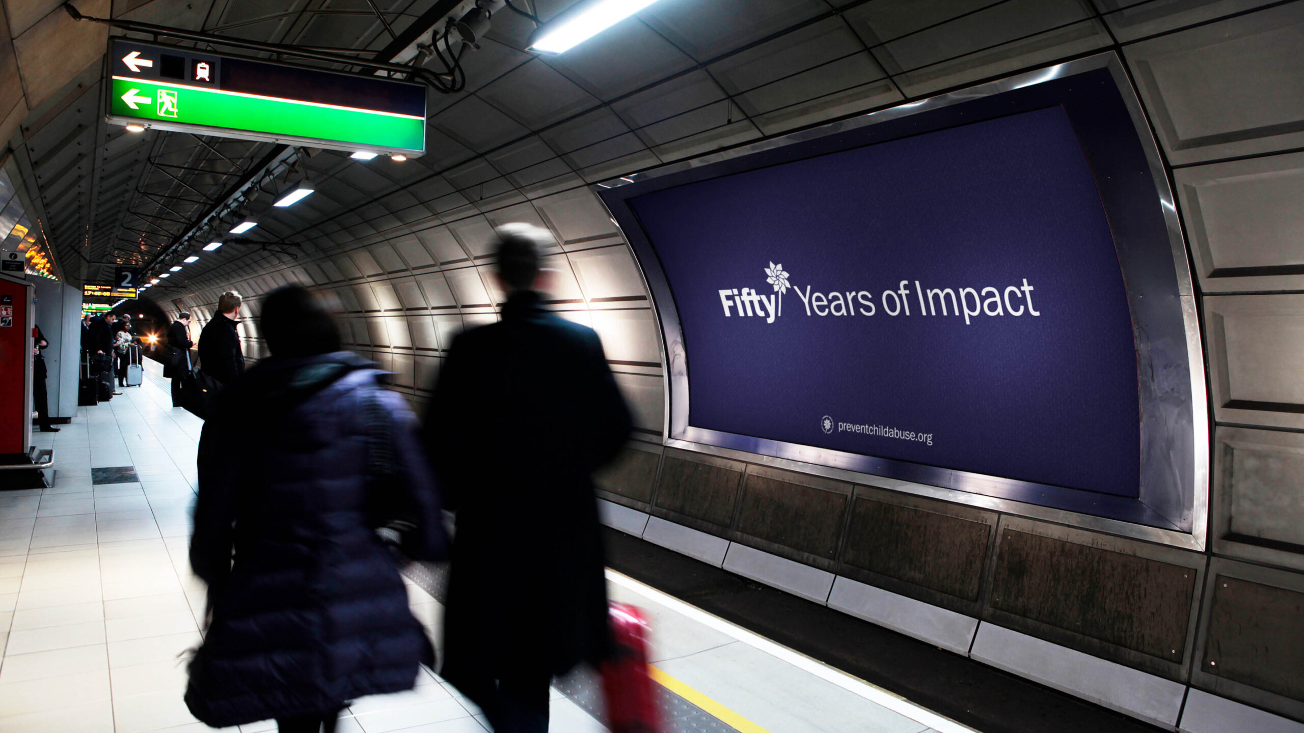 A subway advertisement with the Prevent Child Abuse America 50th anniversary logo saying Fifty Years of Impact