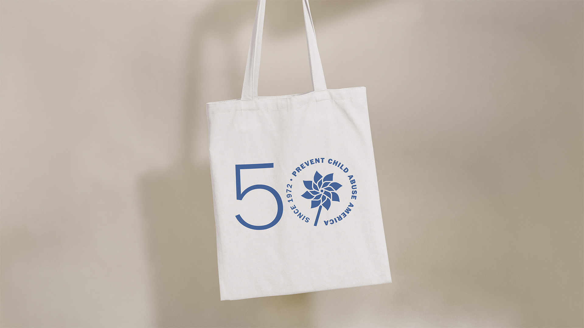 A tote bag with the Prevent Child Abuse America 50th anniversary logo